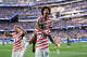 United States' Folarin Balogun (20) celebrates scoring his side's third goal against Paraguay with teamates during the World Cup Group D soccer match in Inglewood, Calif., near Los Angeles, Friday, June 12, 2026. (AP Photo/Andre Penner)