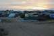 FILE - The sun sets on a refugee camp set up people fleeing war in Sudan, Oct. 3, 2024, in Adre, Chad.