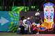 McKenzie Galindo, 4, gets a hand from Arturo Landeros (left) getting down large soccer ball display after posing for a photo with her father Luis Galindo (right) at the Dallas FIFA Fan Festival on Friday, June 12, 2026, in Dallas.