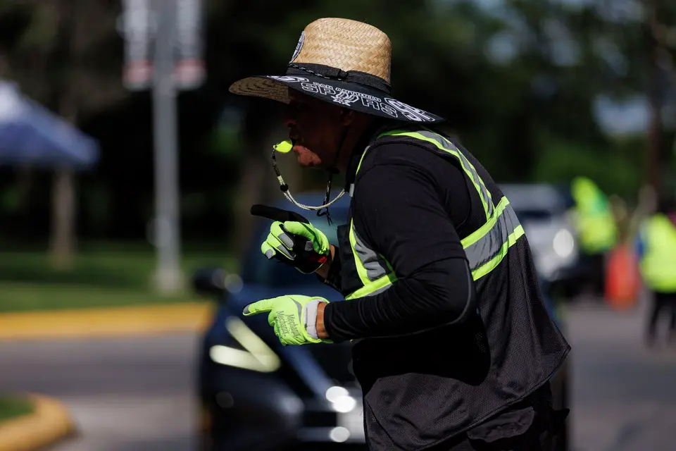 Brett Carter directs traffic before Game 5 of the NBA Finals between the New York Knicks and the San Antonio Spurs at Frost Bank Center in San Antonio, Saturday, June 13, 2026.