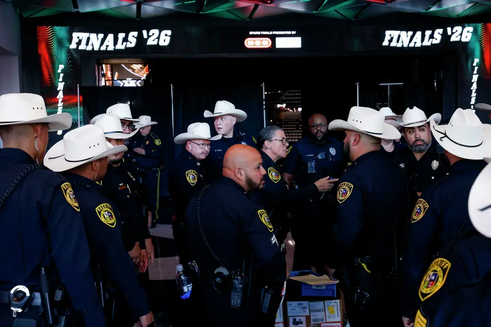 Bexar County sheriff’s deputies wait for their assigned posts before Game 5 of the NBA Finals between the New York Knicks and the San Antonio Spurs at Frost Bank Center in San Antonio on Saturday, June 13, 2026.