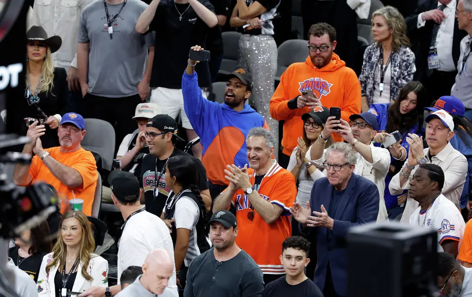 Acctor John Turturro, center, cheers on the Spurs with fans and other stars during the first quarter of game five of the NBA Championship at Frost Bank Center on Saturday, June13, 2026.