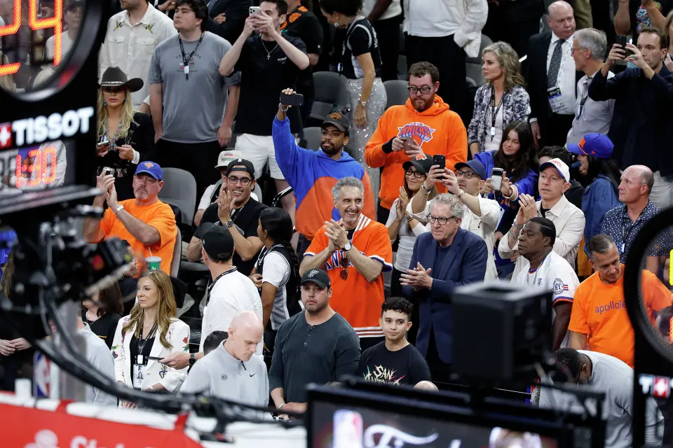 Acctor John Turturro, center, cheers on the Spurs with fans and other stars during the first quarter of game five of the NBA Championship at Frost Bank Center on Saturday, June13, 2026.