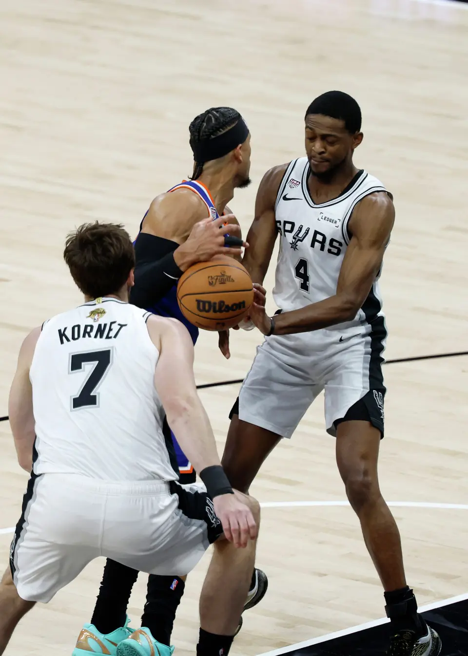 San Antonio Spurs guard De'Aaron Fox (4) knocks the ball away from New York Knicks guard Josh Hart (3) during the first quarter of game five of the NBA Championship at Frost Bank Center on Saturday, June13, 2026.