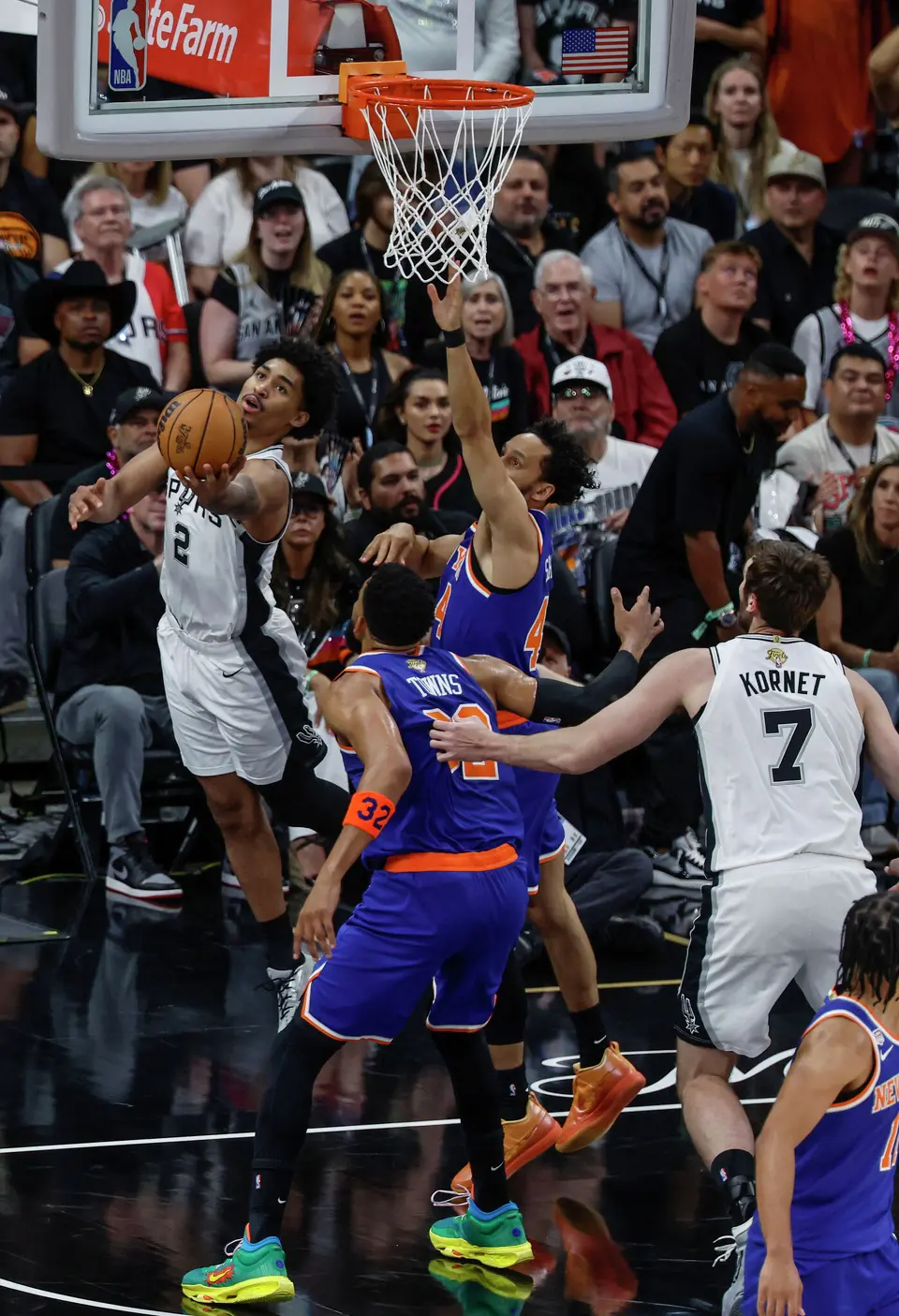 San Antonio Spurs guard Dylan Harper (2) walks the baseline and delivers a reverse layup over New York Knicks guard Landry Shamet (44) during the first quarter of game five of the NBA Championship at Frost Bank Center on Saturday, June13, 2026.
