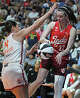 UNCASVILLE, CONNECTICUT - JUNE 13: Caitlin Clark #22 of the Indiana Fever bounces the ball off Charlisse Leger-Walker #4 of the Connecticut Sun along the baseline in the second quarter at Mohegan Sun Arena on June 13, 2026 in Uncasville, Connecticut. NOTE TO USER: User expressly acknowledges and agrees that, by downloading and or using this photograph, User is consenting to the terms and conditions of the Getty Images License Agreement. (Photo by Sean D. Elliot/Getty Images)