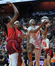 UNCASVILLE, CONNECTICUT - JUNE 13: Aneesah Morrow #24 of the Connecticut Sun drives to the basket defended by Aliyah Boston #7 and Myisha Hines-Allen #2 of the Indiana Fever in the third quarter at Mohegan Sun Arena on June 13, 2026 in Uncasville, Connecticut. NOTE TO USER: User expressly acknowledges and agrees that, by downloading and or using this photograph, User is consenting to the terms and conditions of the Getty Images License Agreement. (Photo by Sean D. Elliot/Getty Images)