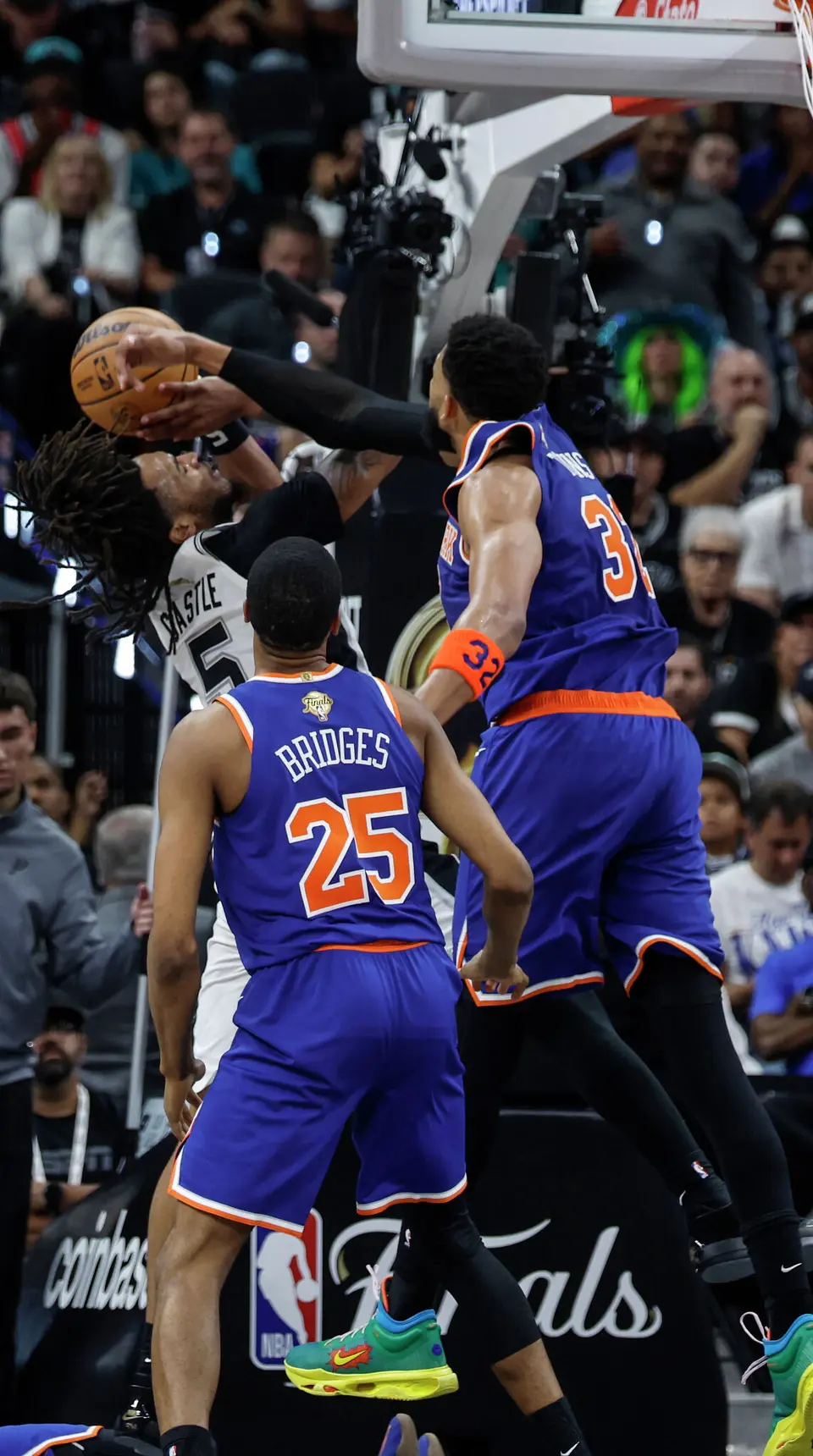 San Antonio Spurs guard Stephon Castle (5) has a shot blocked by New York Knicks center Karl-Anthony Towns (32) during the second quarter of game five of the NBA Championship at Frost Bank Center on Saturday, June13, 2026.
