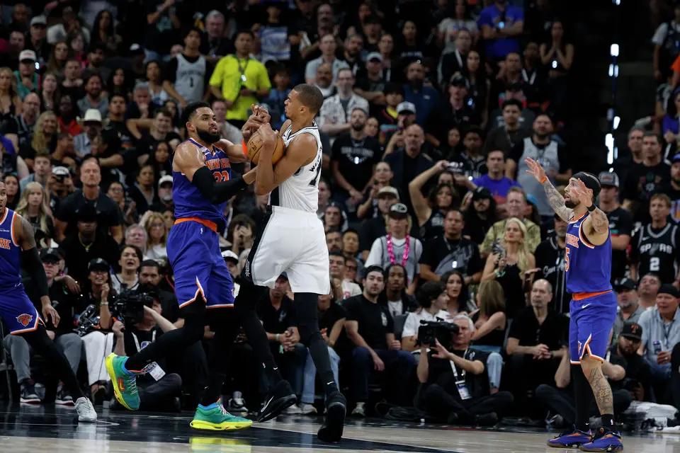 San Antonio Spurs center Victor Wembanyama (1) and New York Knicks center Karl-Anthony Towns (32) fight over a loose ball during the second quarter of game five of the NBA Championship at Frost Bank Center on Saturday, June13, 2026. 2