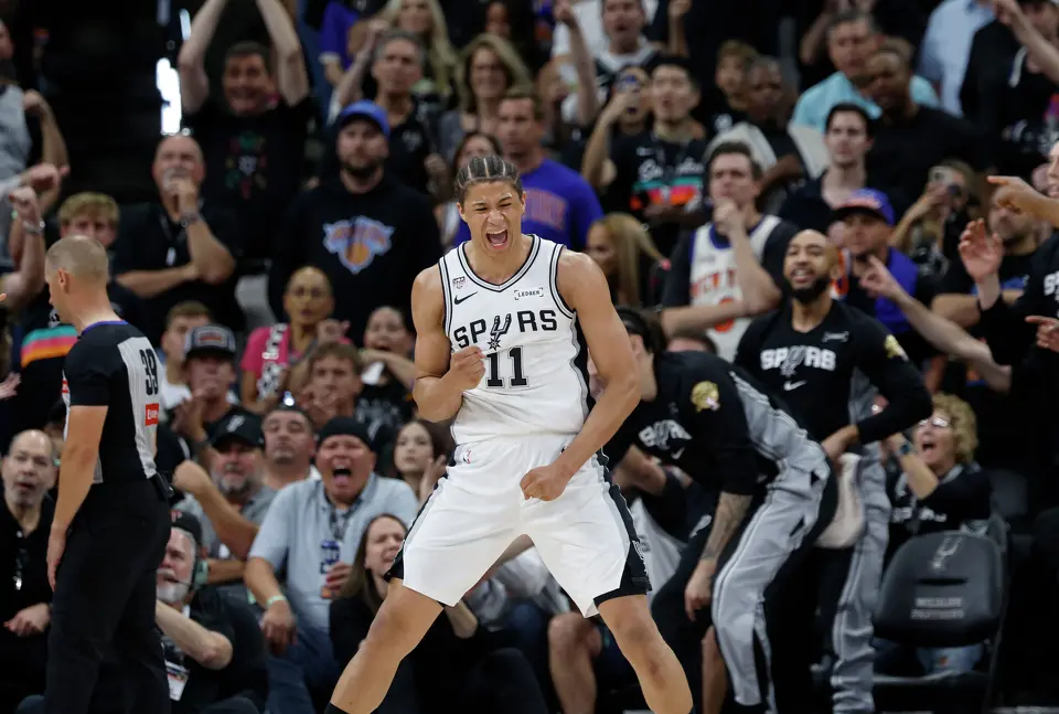 San Antonio Spurs forward Carter Bryant (11) celebrates a call during the second quarter of game five of the NBA Championship at Frost Bank Center on Saturday, June13, 2026.