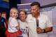 Frisco mayoral candidate Mark Hill smiles with his wife Tiffany and daughter Emily, 7, as he prepares to speak to supporters during his election night watch party at The Frisco Bar & Grill on Saturday, June 13, 2026, in Frisco.