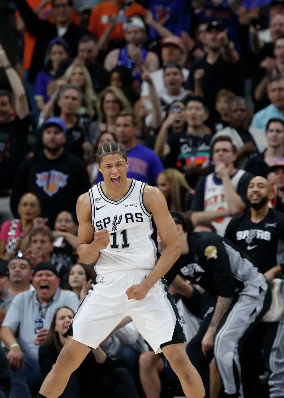 San Antonio Spurs forward Carter Bryant (11) celebrates a call during the second quarter of game five of the NBA Championship at Frost Bank Center on Saturday, June13, 2026.
