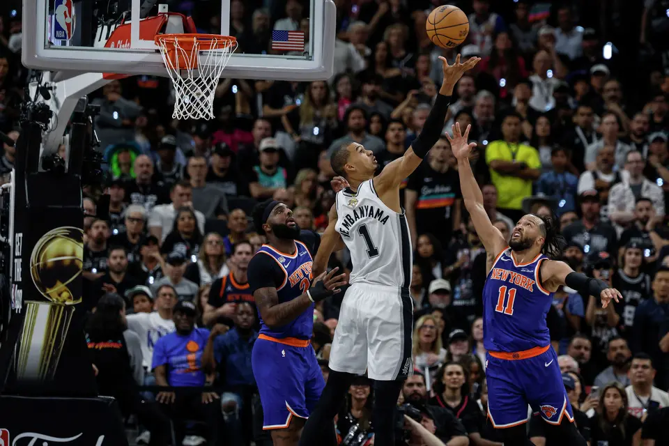 San Antonio Spurs center Victor Wembanyama (1) comes up with the rebound over New York Knicks guard Jalen Brunson (11) during the second quarter of game five of the NBA Championship at Frost Bank Center on Saturday, June13, 2026.