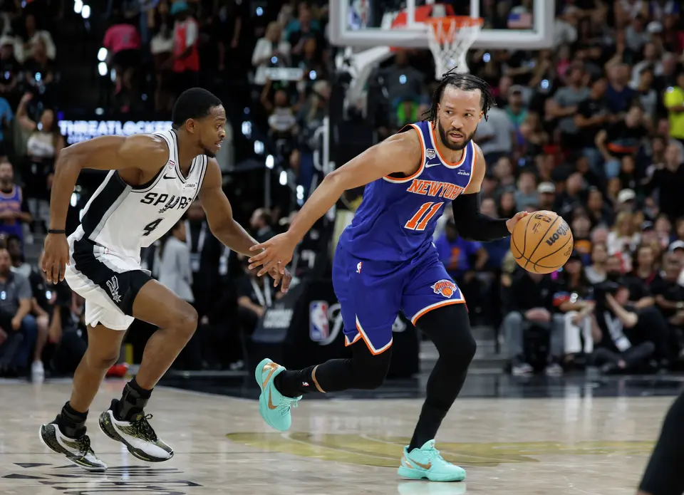 San Antonio Spurs guard De'Aaron Fox (4) guards New York Knicks guard Jalen Brunson (11)during the second quarter of game five of the NBA Championship at Frost Bank Center on Saturday, June13, 2026.