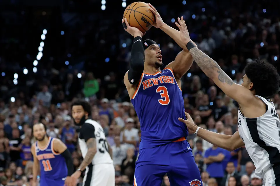 New York Knicks guard Josh Hart (3) takes a jump shot over San Antonio Spurs guard Dylan Harper (2) during the second quarter of game five of the NBA Championship at Frost Bank Center on Saturday, June13, 2026.