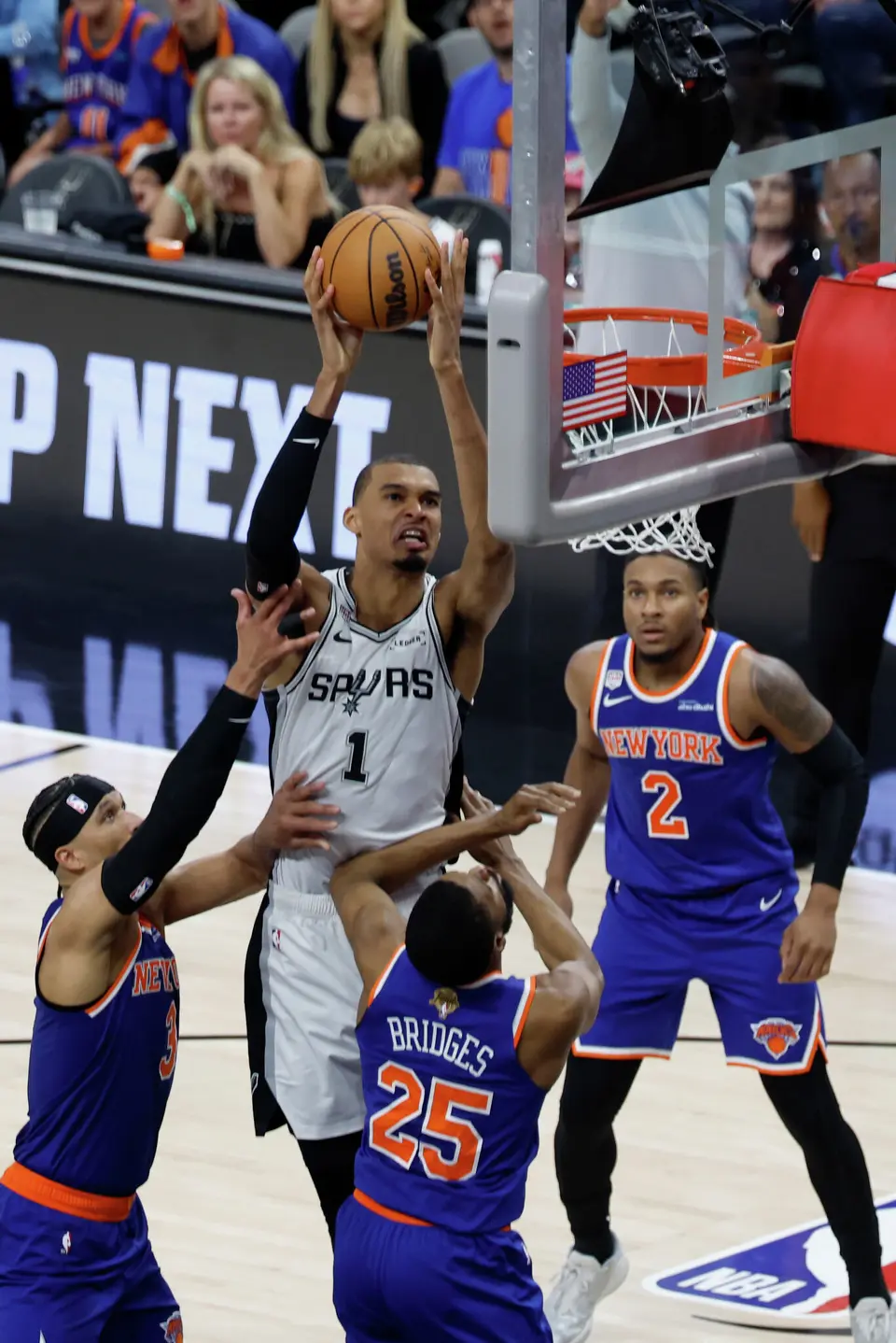 San Antonio Spurs center Victor Wembanyama (1) gets a clean shot at the basket over New York Knicks guard Mikal Bridges (25) and New York Knicks guard Josh Hart (3) during the third quarter of game five of the NBA Championship at Frost Bank Center on Saturday, June13, 2026.