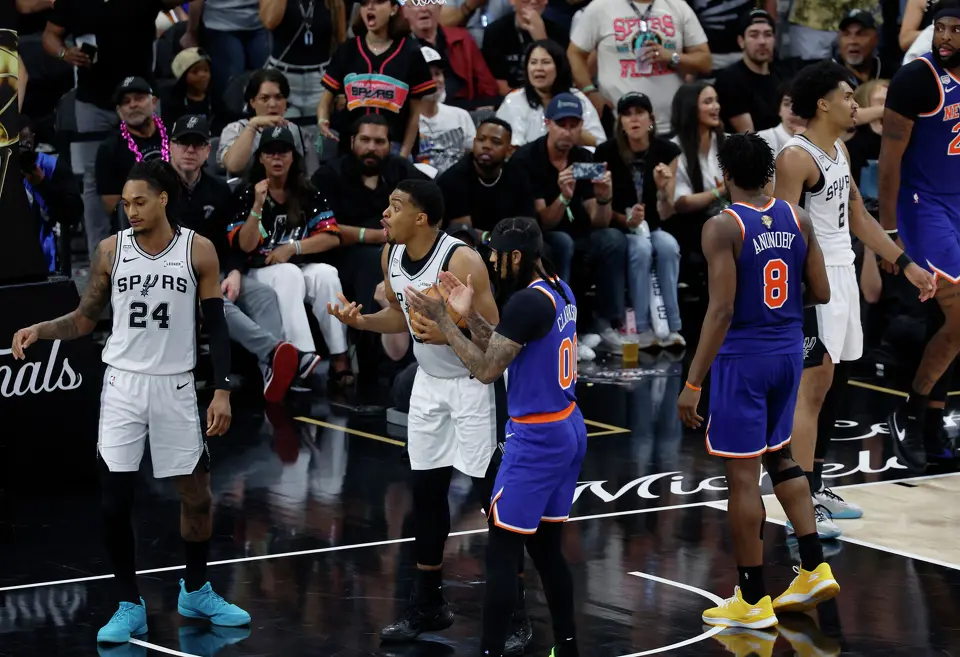 San Antonio Spurs forward Keldon Johnson (3) questions the call by a referee during the third quarter of game five of the NBA Championship at Frost Bank Center on Saturday, June13, 2026.