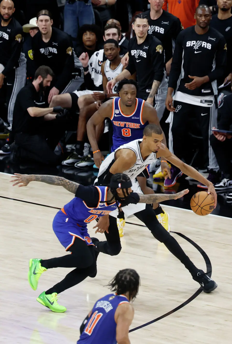 San Antonio Spurs center Victor Wembanyama (1) tries to get past New York Knicks guard Jordan Clarkson (00) during the third quarter of game five of the NBA Championship at Frost Bank Center on Saturday, June13, 2026.