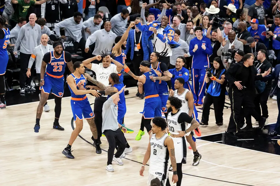San Antonio Spurs players walk off while New York Knicks players run onto the court after they defeated the San Antonio Spurs in Game 5 of the NBA Finals at Frost Bank Center in San Antonio on Saturday, June 13, 2026. The New York Knicks defeated the Spurs 94-90.