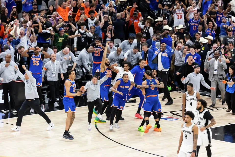 New York Knicks players run onto the court after defeating the San Antonio Spurs in Game 5 of the NBA Finals at Frost Bank Center in San Antonio on Saturday, June 13, 2026. The New York Knicks defeated the Spurs 94-90.