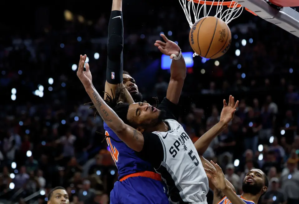San Antonio Spurs guard Stephon Castle (5) has the ball knocked away by the Knicks defense during the fourth quarter of game five of the NBA Championship at Frost Bank Center on Saturday, June13, 2026.