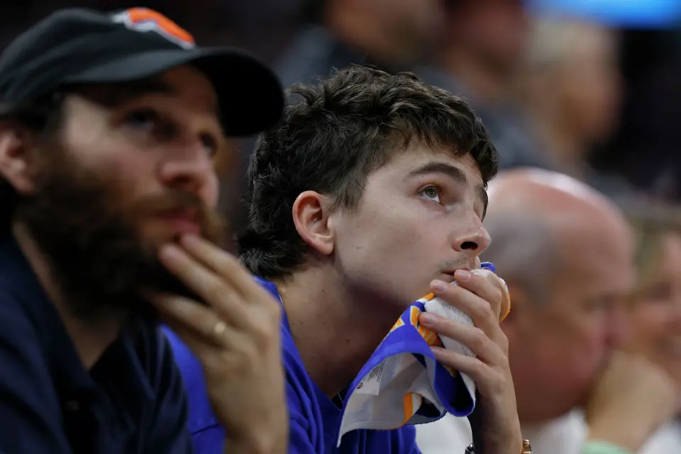 Actor Timothée Chalamet, right, and director Josh Safdie , left, look up at the scoreboard in a close game between the Knicks and the Spurs in the fourth quarter of game five of the NBA Championship at Frost Bank Center on Saturday, June13, 2026.