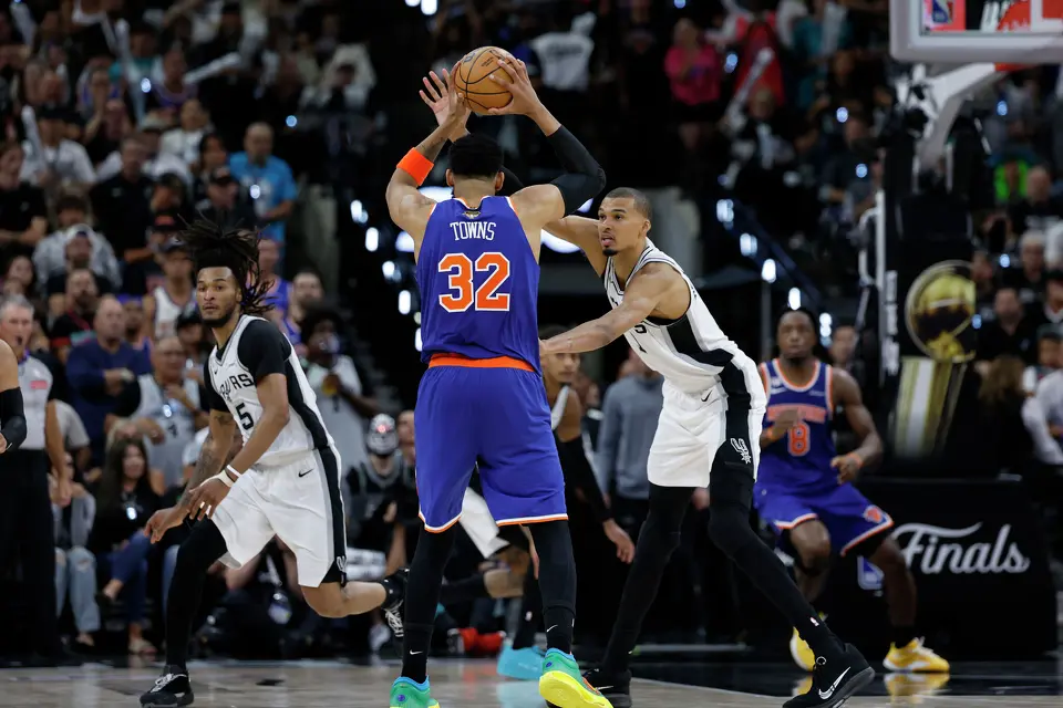 San Antonio Spurs center Victor Wembanyama (1) guards New York Knicks center Karl-Anthony Towns (32) during the fourth quarter of game five of the NBA Championship at Frost Bank Center on Saturday, June13, 2026.