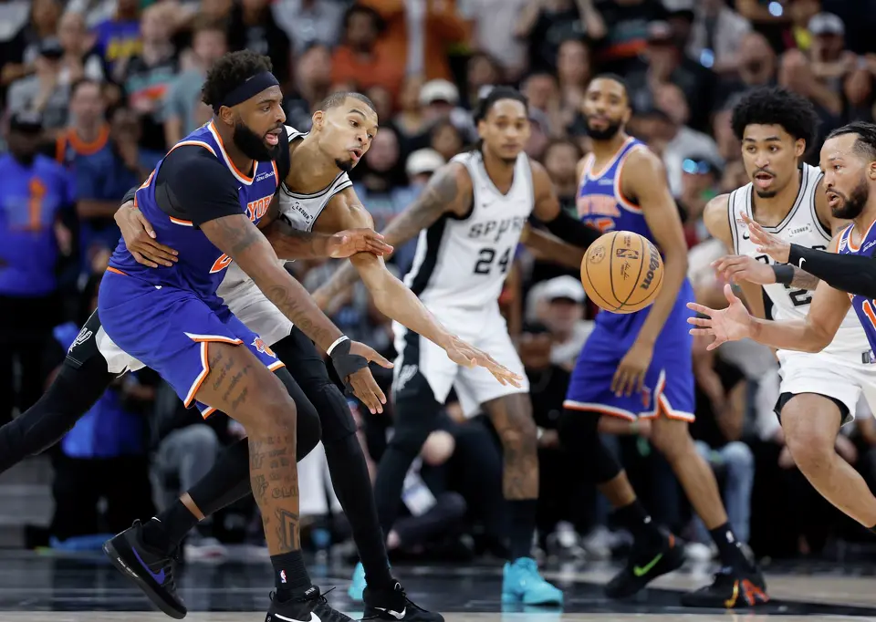 San Antonio Spurs and New York Knicks players go after a loose ball during the fourth quarter of game five of the NBA Championship at Frost Bank Center on Saturday, June13, 2026.