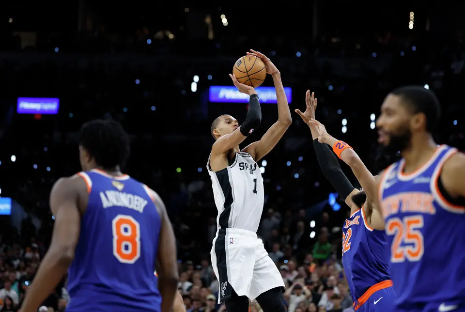 San Antonio Spurs center Victor Wembanyama (1) takes a shot over New York Knicks center Karl-Anthony Towns (32) during the fourth quarter of game five of the NBA Championship at Frost Bank Center on Saturday, June13, 2026.