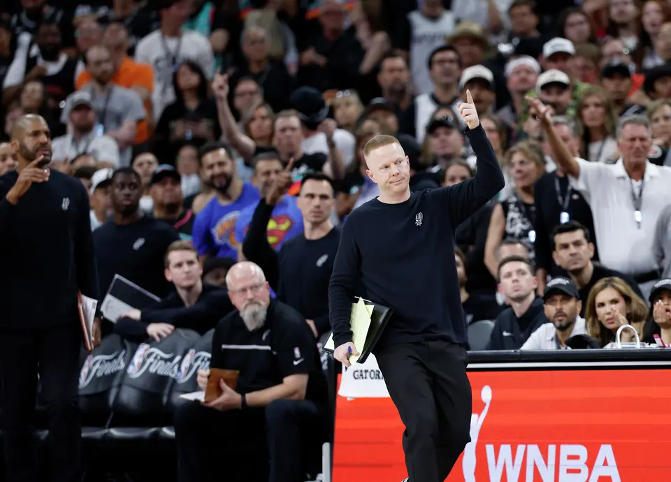 San Antonio Spurs Associate Head Coach Sean Sweeney calls in a play during the fourth quarter of game five of the NBA Championship at Frost Bank Center on Saturday, June13, 2026.