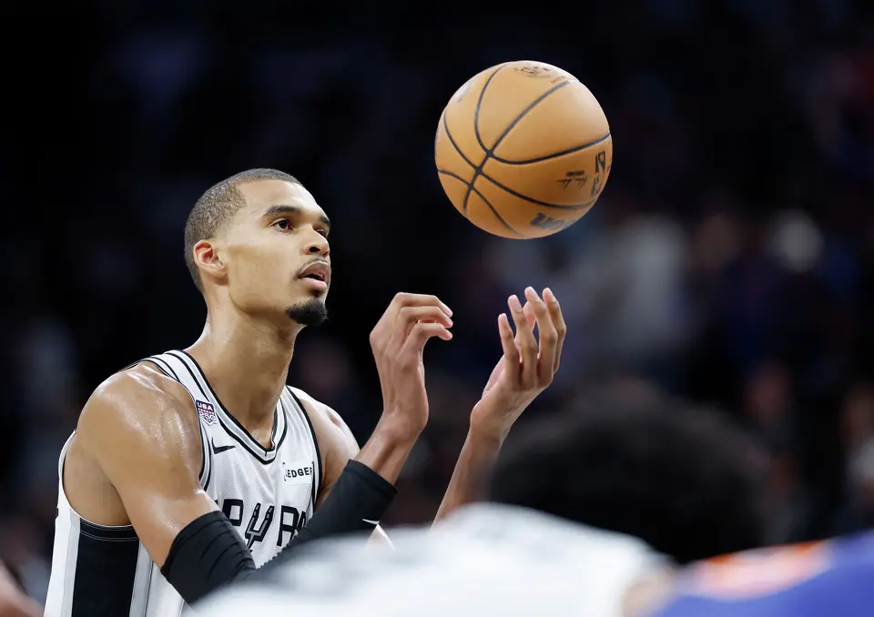 San Antonio Spurs center Victor Wembanyama (1) spins the ball in the air prior to shooting a free throw during the fourth quarter of game five of the NBA Championship at Frost Bank Center on Saturday, June13, 2026.