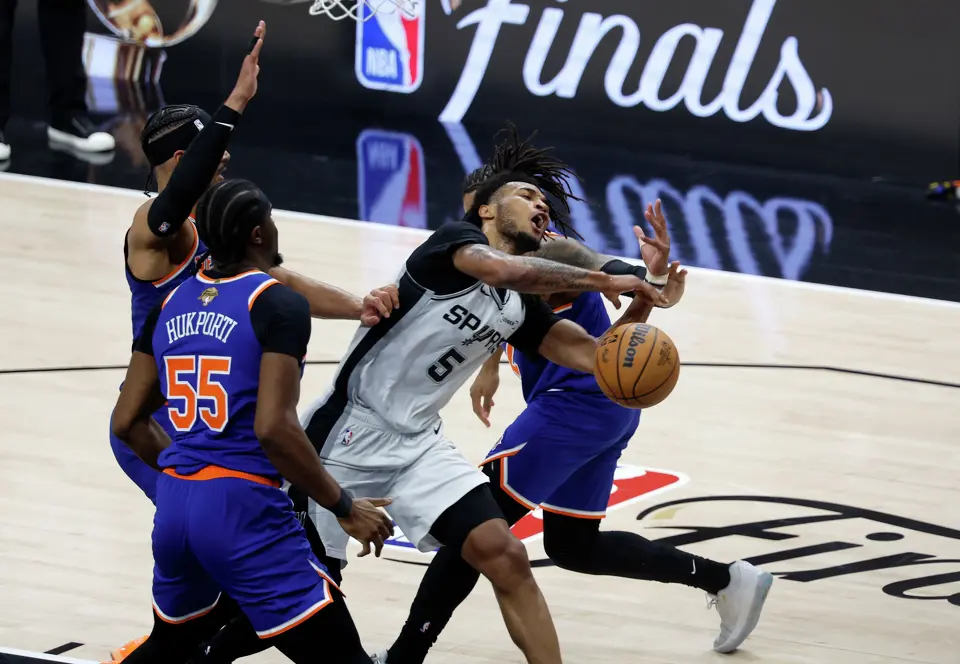 San Antonio Spurs guard Stephon Castle (5) has the ball knocked away by a Knicks defender during the third quarter of game five of the NBA Championship at Frost Bank Center on Saturday, June13, 2026.