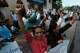 Supporters of Rong Chhun, a prominent Cambodian opposition politician, shout slogans outside the Supreme Court in Phnom Penh, Cambodia, Monday, June 15, 2026.
