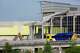 A DART buses crosses the Jefferson Boulevard Viaduct near demolition work on the Kay Bailey Hutchison Convention Center in Dallas, Monday, June 15, 2026.
