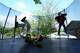 Ian Contreras, right, jumps on a trampoline with Jose Gonzalez after arriving home from school Thursday, April 9, 2026, in Fort Worth, Texas.