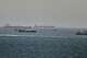 Tankers and cargo vessels are seen in the Gulf of Oman, along shipping routes linking the Strait of Hormuz and the Arabian Sea, Tuesday, June 16, 2026.