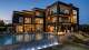 A rendering depicts the rear view of the steel frame Infinity property at 3980 Starling Drive, Frisco. The construction method uses a 3D printer to print steel frames to be assembled on site.