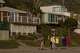 FILE: Kids walk past several newly refurbished cottages at Crystal Cove State Park in Newport Beach, Calif.
