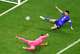 Croatia goalkeeper Dominik Livakovic (1) dives and forward Ivan Perišic (14) slides in vein as England forward Marcus Rashford’s goal slices between them in the second half of a FIFA World Cup Group L soccer match at Dallas Stadium in Arlington, June 17, 2026.