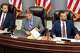Left to right, Madison County State's Attorney Tom Haine, County Administrator Dave Tanzyus and County Board Chairman...
