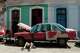 A man works on a classic American car in Havana, Cuba, Wednesday, June 17, 2026.