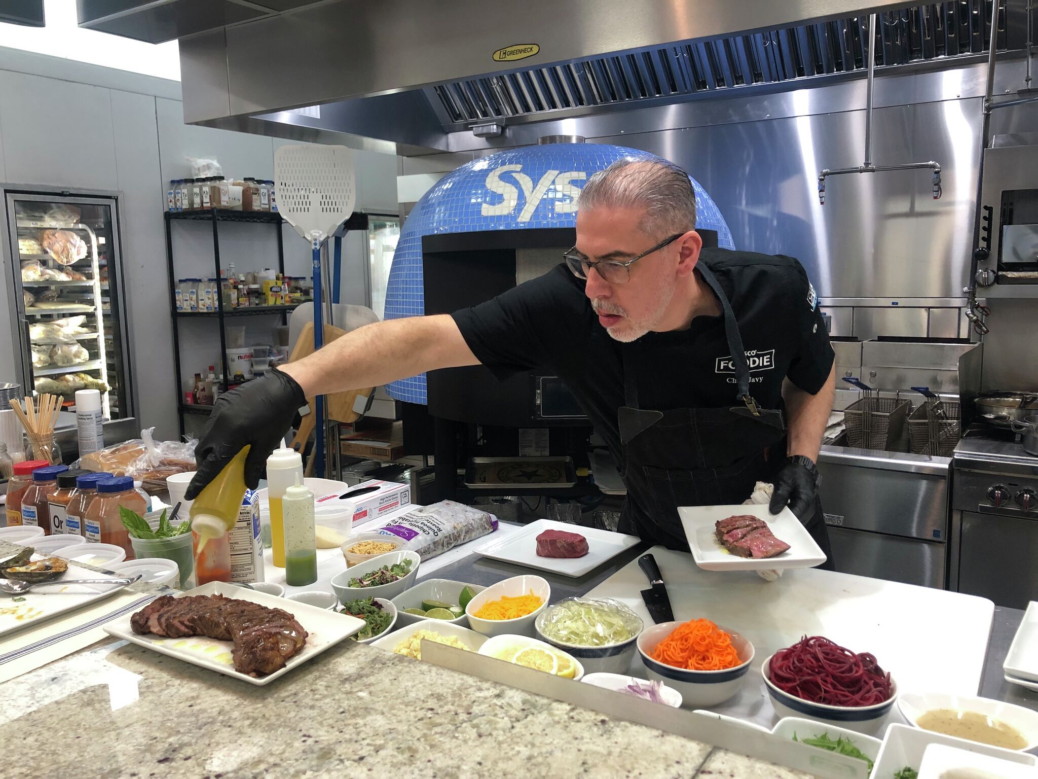 chron.com - John-Henry Perera - Critics say Sysco is enormous. The company says that's the point.