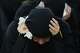 A woman mourns during a sermon marking the third day of Ashoura, the Shiite Muslim commemoration of the 7th-century death of Imam Hussein, the grandson of the Prophet Muhammad, in the southern port city of Tyre, Lebanon, Friday, June 19, 2026.