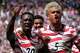 United States' Folarin Balogun (20) and Antonee Robinson (5) celebrate after scoring during the World Cup Group D soccer match between the United States and Australia in Seattle, Friday, June 19, 2026.