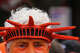 A man wears orange faceprint and an orange version of the Statue of Liberty’s headpeice during the Oranje Fanwalk, hosted by Koninklijke Nederlandse Voetbalbond and the Royal Dutch Football Association, in support of the Netherlands as they prepare to face Sweden at Houston Stadium in Houston, June 20, 2026.