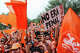 Netherlands fans wave flags and cheer during the Oranje Fanwalk, hosted by Koninklijke Nederlandse Voetbalbond and the Royal Dutch Football Association, in support of the Netherlands as they prepare to face Sweden at Houston Stadium in Houston, June 20, 2026.