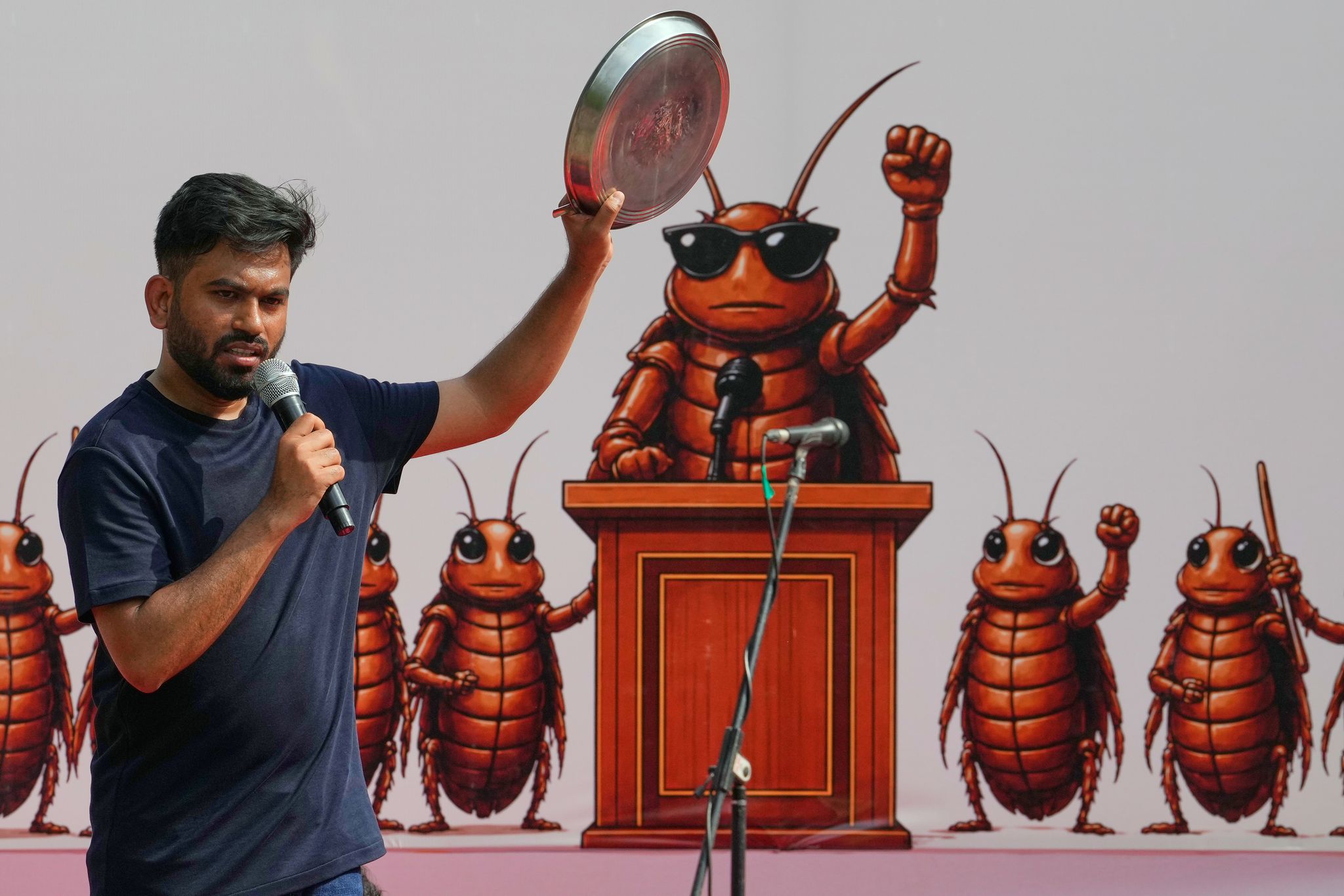 India's Cockroach Party supporters bang plates to call for education ...