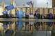 FILE - Protestors are reflected in a large puddle as they wave European flags to demonstrate against Brexit in front of the Parliament in London, Dec. 3, 2018.