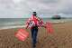 FILE- Anti Brexit campaigner Steve Bray walks on the beach to pose for a photograph during the Labour Party Conference at the Brighton Centre in Brighton, England, Monday, Sept. 23, 2019.