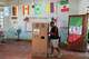 A voter marks his ballot in a classroom decorated with flags of countries participating in the World Cup serving as a polling station during the presidential runoff election in Santander de Quilichao, Colombia, Sunday, June 21, 2026.
